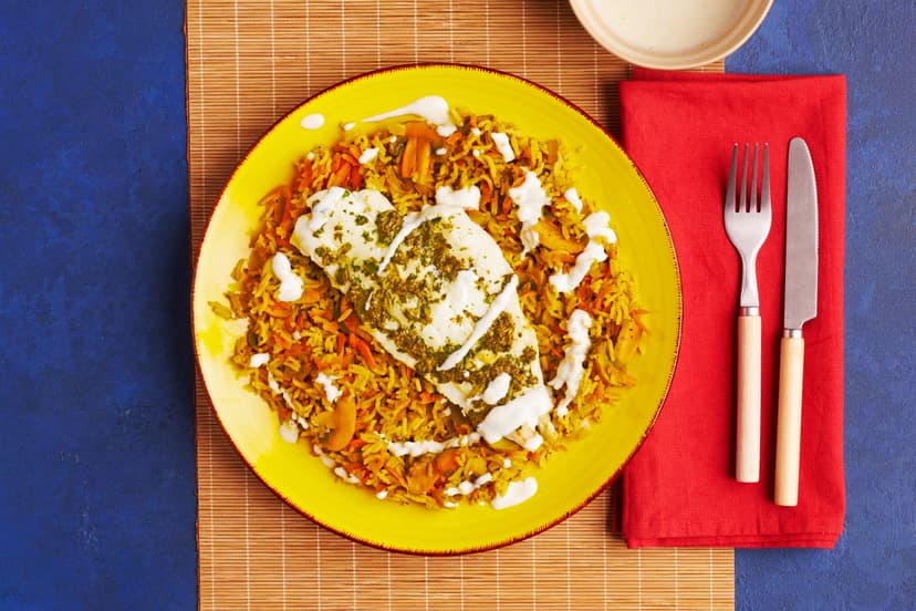 Cod has always been firm friends with lemon – now aromatic coriander joins the party! Together they bake to perfection while a simple rice pilaf, packed with mushrooms, onion and carrot, takes shape. Simmered with a super-easy garlic & herb paste, it's a delish base for those tasty hunks of fish.