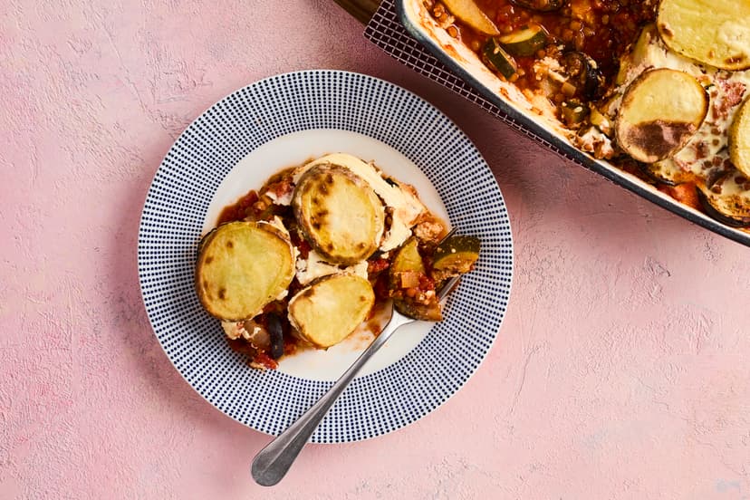 Each luxurious layer of this gorgeous vegetarian bake will take your taste buds on a Greek odyssey. Sink your serving spoon through crispy potatoes, soft aubergines, a lightened-up bechamel-style sauce, and cinnamon-spiced lentils, courgette and tomatoes with a hint of mint.