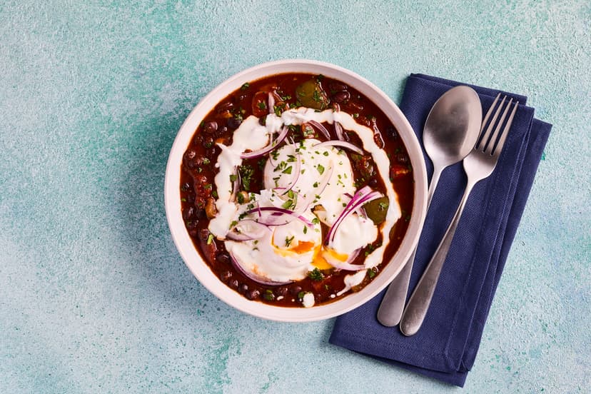 Like shakshuka? You'll love our warming Tex-Mex stew with black beans for extra filling power. They’re simmered with carrot, green pepper and onion in a spicy tomato sauce, and finished with gently poached eggs, sprinkled with parsley and fresh onion and a drizzle of yogurt. Delicious any time of the day!
