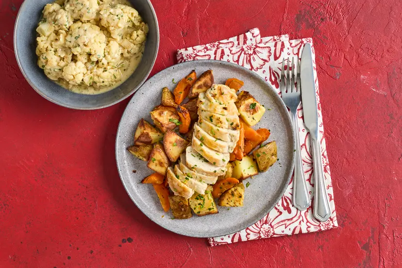 Winner, winner – not your average chicken dinner! Garlicky chicken breasts are served with roast potatoes and carrots, plus cauliflower florets simmered in a rich and savoury onion sauce, spiked with mustard, miso and parsley and made creamy with a swirl of yogurt.