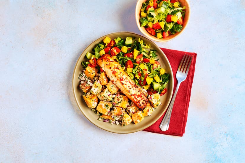 This'll put a zing in your step! Salmon fillets are dressed with chilli and orange zest, then popped under the grill until perfectly done. Meanwhile, a duo of stunning salads take shape: sweet potato tossed in herby yogurt, and lettuce, cucumber and tomato spiked with chunks of orange and a zip of lemon juice.