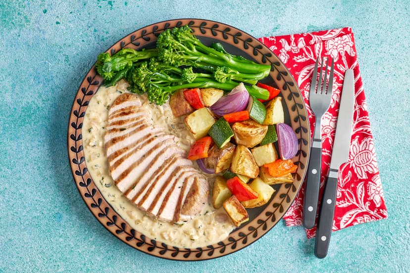 Feeling fancy? Fill your boots with tender medallions in a show-stopping sauce. While potatoes, onion, pepper and courgette roast, tender pork loin is simply sautéed, then sizzled with shallots and fresh thyme. Dijon mustard and a dash of creamy yogurt make a super-tasty sauce, while vibrant broccoli adds the perfect finishing touch.