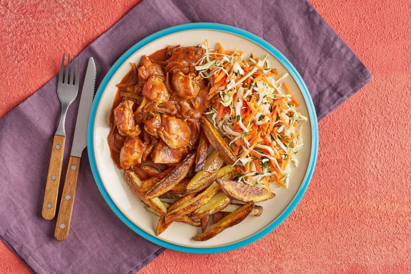 Crank up the sunshine in your kitchen with a smokin' hot serving of our sauciest jerk chicken! Juicy thigh meat is sizzled with onion and garlic, smothered in our special Slimming World jerk seasoning and allspice, and simmered in a tomatoey stock. Add crispy chips, a zingy lime and coriander slaw...and devour!