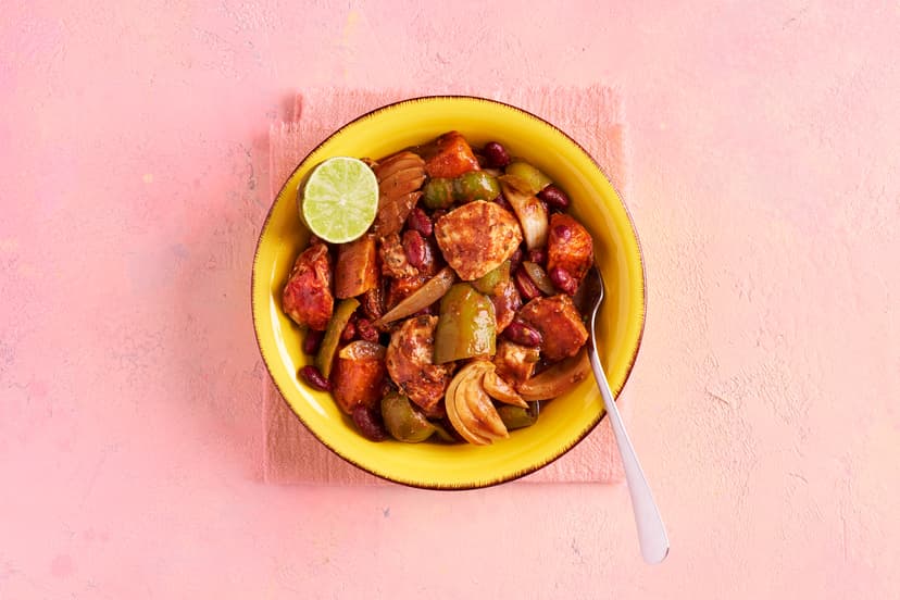 Take your evening seriously easy with this sun-kissed supper. Sweet potatoes are oven roasted, then in hop onions, pepper, chicken and kidney beans. A punchy mix of jerk spice, chilli and thyme add pow to a passata sauce, then itʼs back in the oven for a final bake. A good squeeze of lime, and bingo!