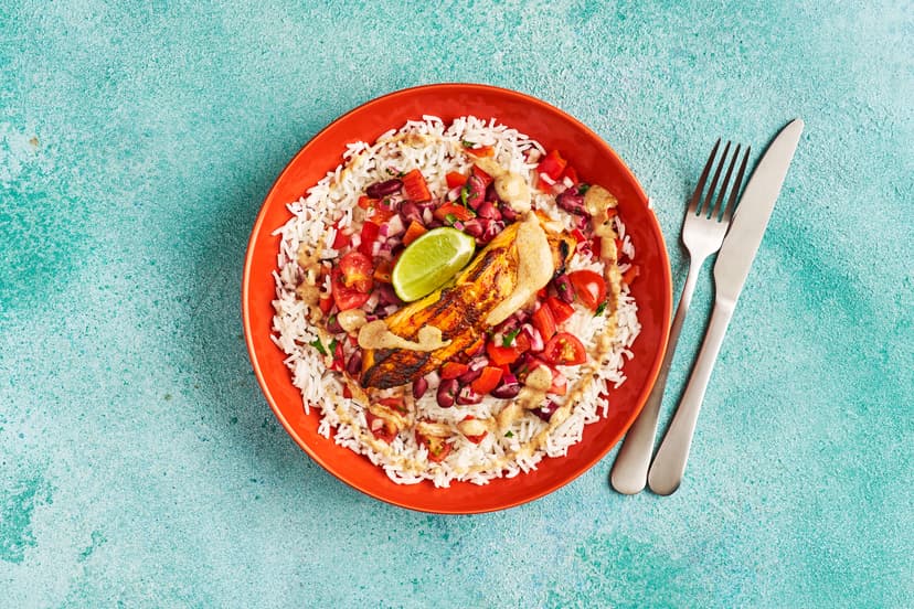 Ay caramba, what a cracking fish dish! Grilled salmon fillets are spiced with hot and smoky chipotle paste. Next comes a simple salsa of onion, pepper, tomato and kidney beans, zhuzhed up with a coriander and lime dressing. Add a spicy yogurt drizzle and fluffy white rice to soak up those fiesta flavours.