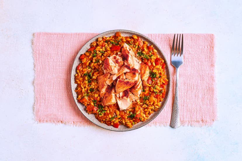 This glowy rice dish is as close as you’ll get to sunshine on a plate! With smoky paprika-sprinkled salmon flakes, sweet red pepper, and a sun-dried tomato, garlic and chilli-flecked sauce, all soaked up by plump arborio rice, it’s the perfect antidote to cloudy skies…