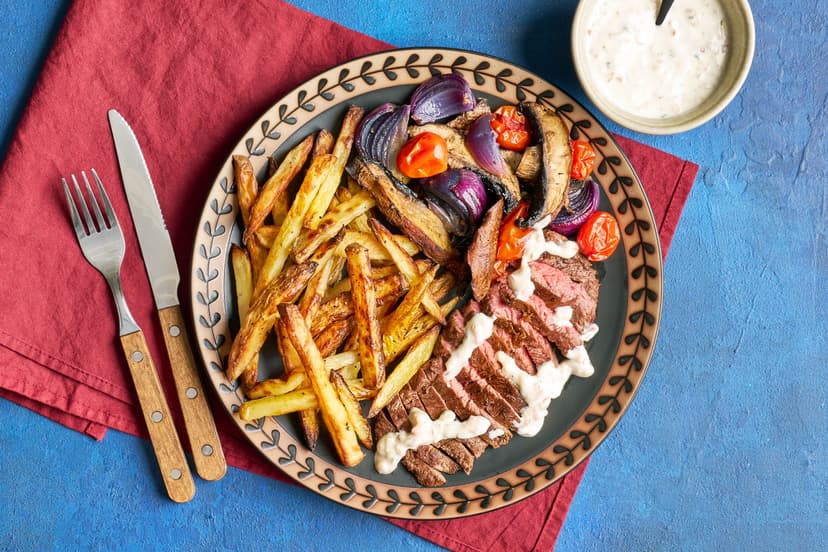 Juicy steak, plated up with skin-on fries and a medley of roasted red onion, baby tomatoes and portobello mushrooms. Drizzled with a creamy Dijon mustard and tarragon sauce, it’s Date Night on a plate. Whether you go for candlelight or the glow of the telly is up to you!